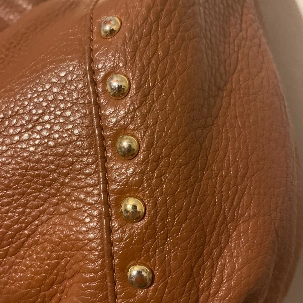 Michael Kors cognac pebbled leather hobo bag w hang tag